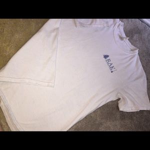 White and blue RAK shirt.